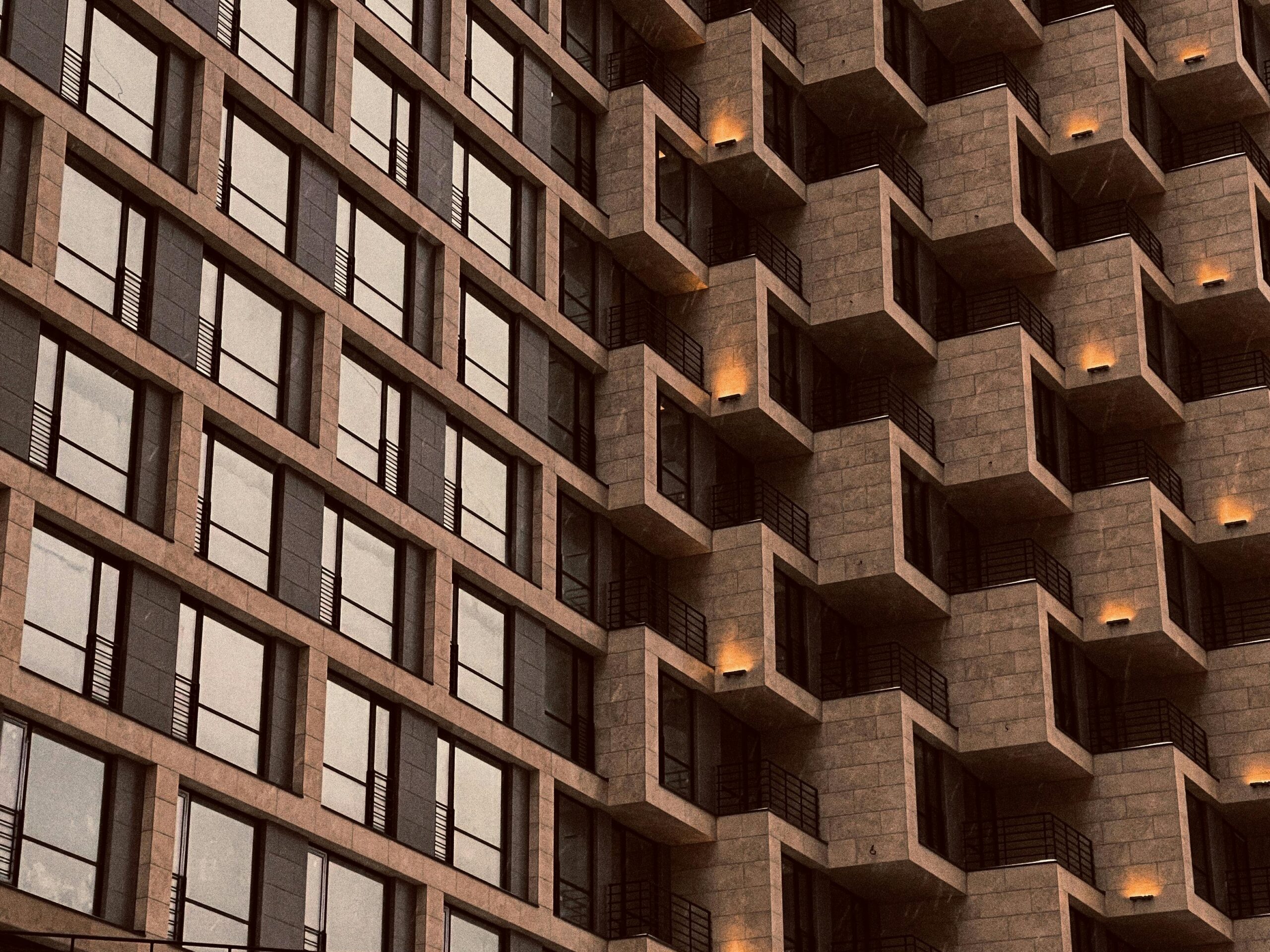 Modern building facade with geometric patterns and warm tones in Moscow, Russia.